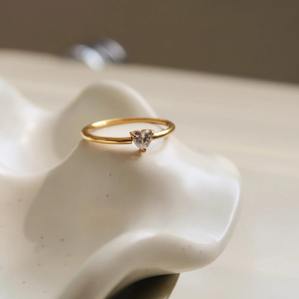 Golden electroplated stainless steel ring with love heart or oval design for women in sizes 6, 7 and 8