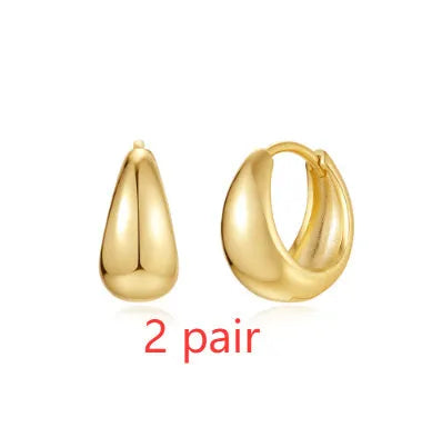 Golden electroplated brass earclip earrings with geometric round design