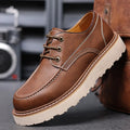 Men's black retro Martin-style low-top boots with round toe and non-slip rubber sole.