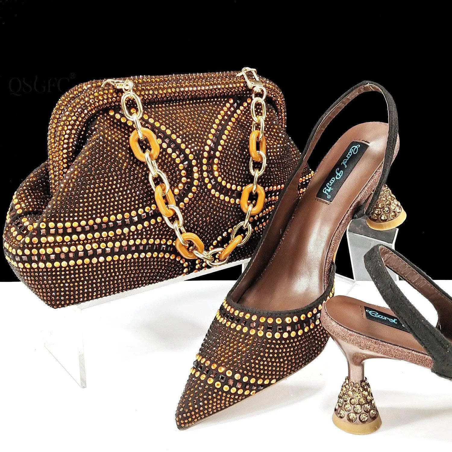 Women's pointed toe high heel shoes with decorative rhinestones and a matching small bag, shown in blue.