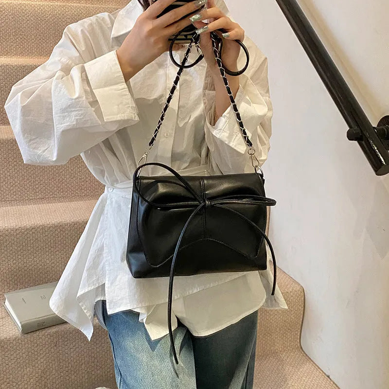 Women's large capacity horizontal square underarm bag in PU material with sewing line details and multiple colour options