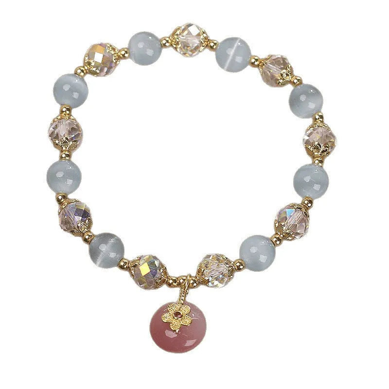 Chinese style sky blue opal peace buckle pendant bracelet for women on a flat surface