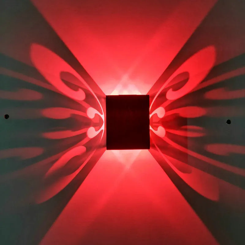 Modern aluminium LED butterfly wall lamp with remote control for seven colour options on interior wall