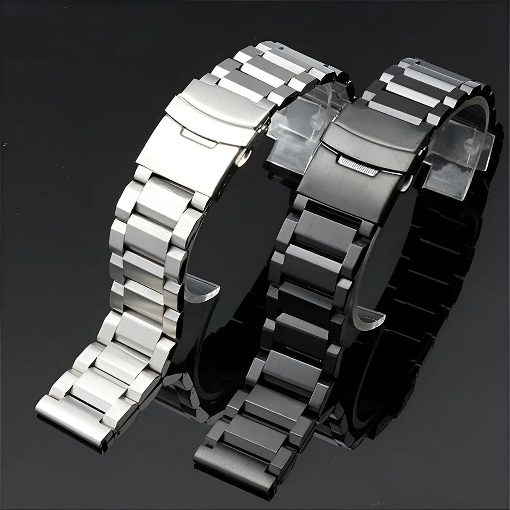 Solid stainless steel watch strap with double-security buckle and quick release pins in silver finish on black background