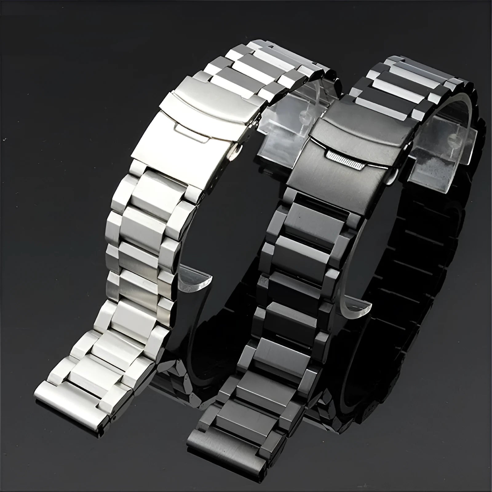 Solid stainless steel watch strap with double-security buckle and quick release pins in silver finish on black background