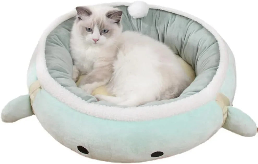 Green dinosaur and chick shaped cat bed shown both flat and hanging as a hammock