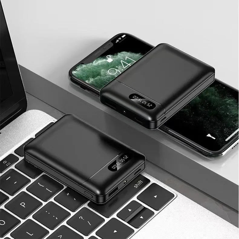 Black and white portable power bank with multi-U charging ports for smartphones and tablets