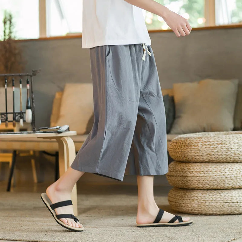 Straight cut linen summer shorts in khaki colour shown on hanger