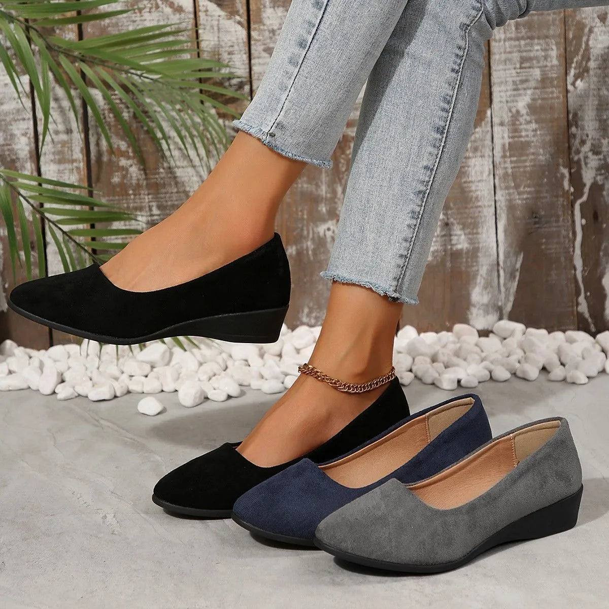 Women's pointed toe suede wedge pumps in light brown with a shallow mouth cut and low rubber sole.