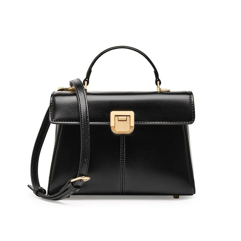 Black genuine vachette leather women's shoulder bag with clasp closure, showing square shape and adjustable strap.