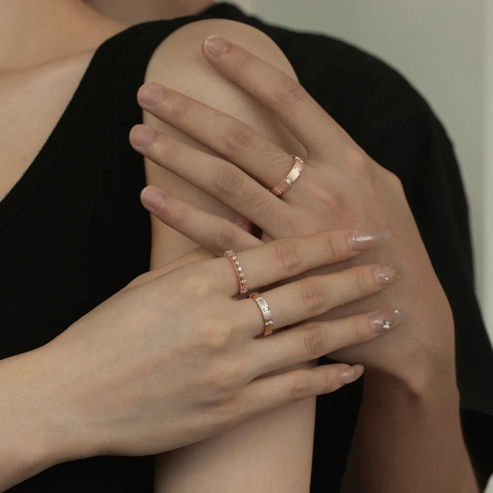 S925 sterling silver slim ring with round zirconium inlay and geometric cutout pattern on a white background