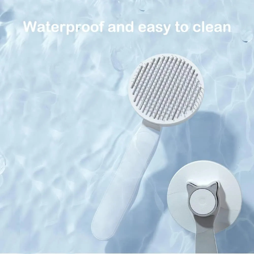 Blue self-cleaning cat and dog brush with rubber handle and retractable pins