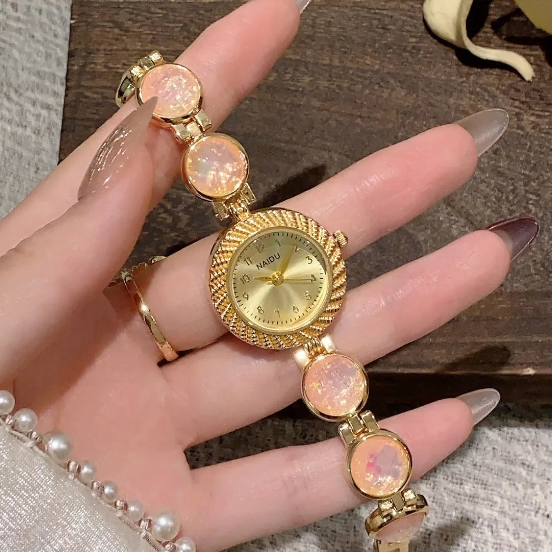 Women's quartz watch with 25mm round dial in choice of six colours on wrist.