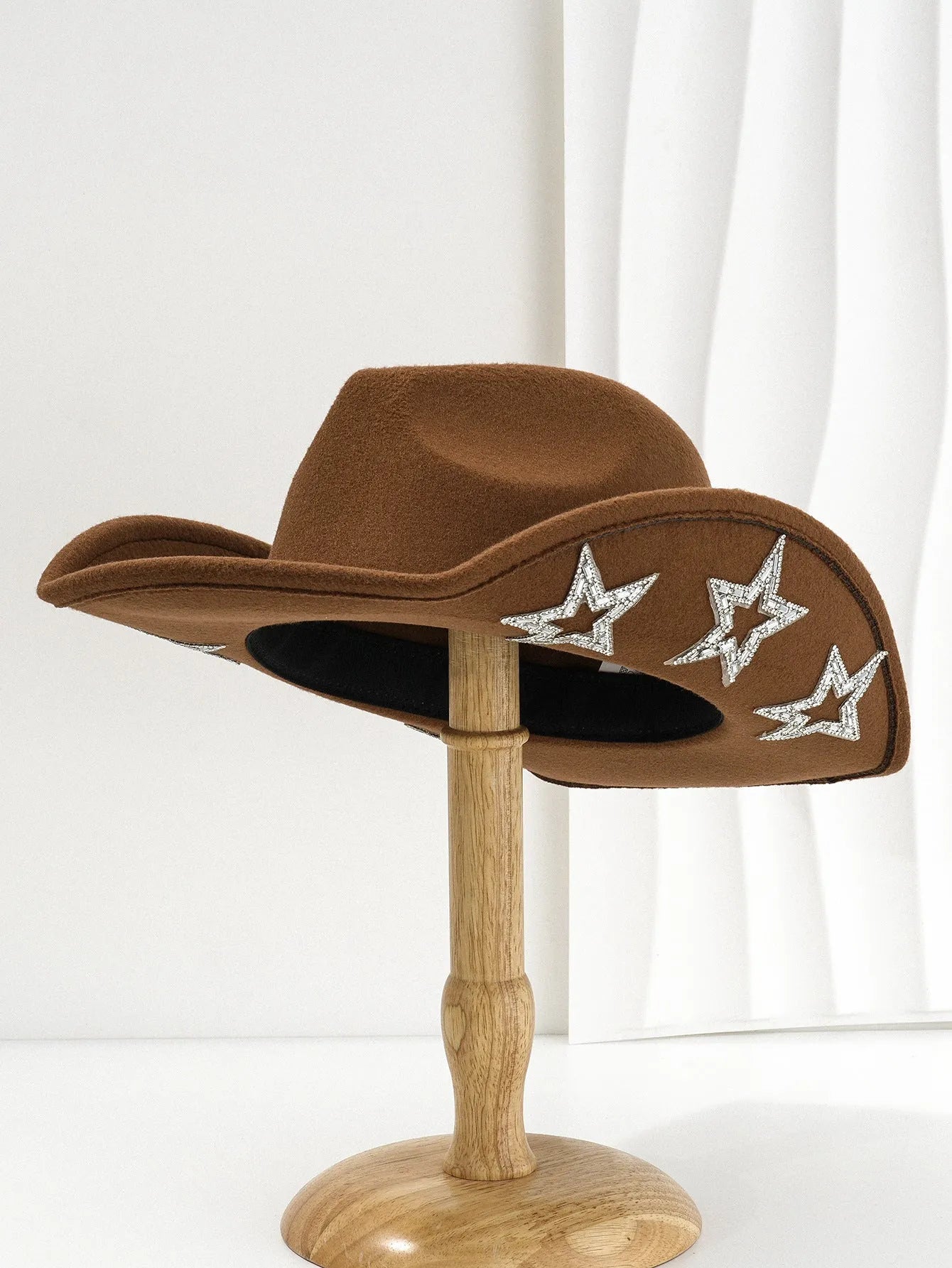 Brown polyester western-style top hat with a conical crown and a silver hexagonal star decoration on the front.