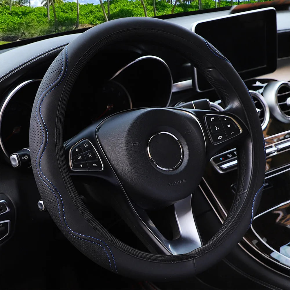 Black elastic steering wheel cover with a corrugated texture, stretched to show its fit.