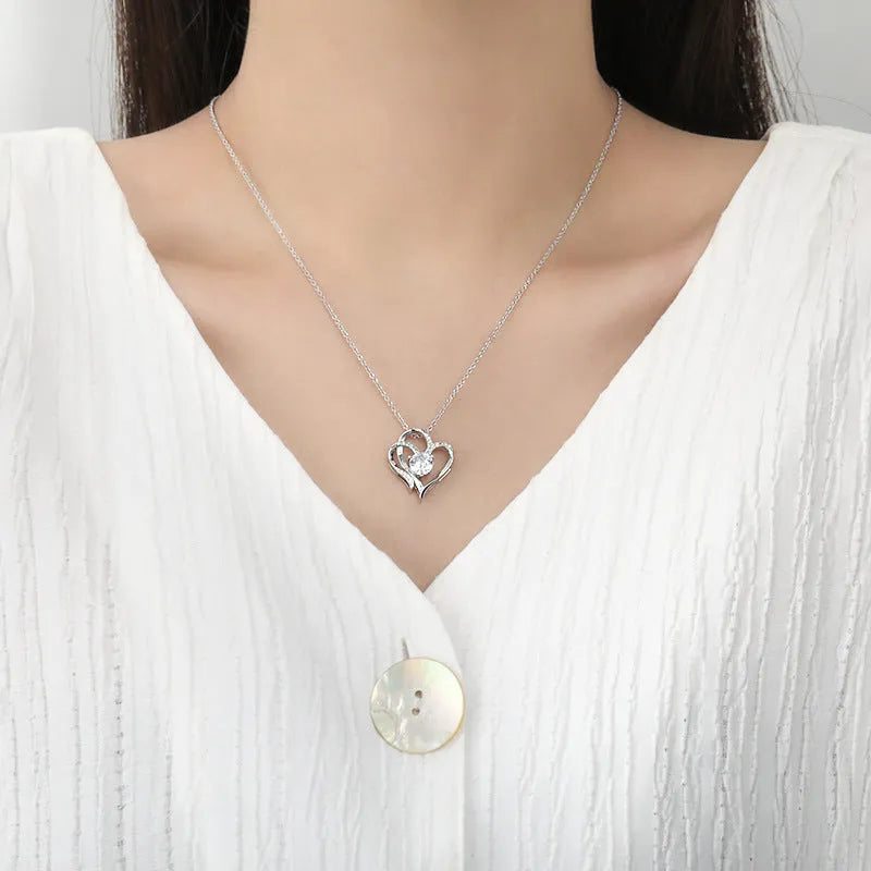 Women's heart-shaped pendant necklace in 925 silver with choice of platinum, gold, or rose gold finish.