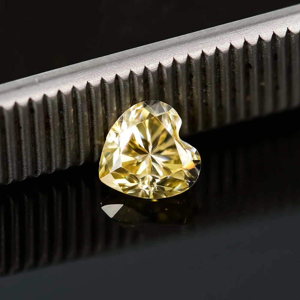 Heart-shaped moissanite stone in lemon yellow colour showing precise cut and dimensions