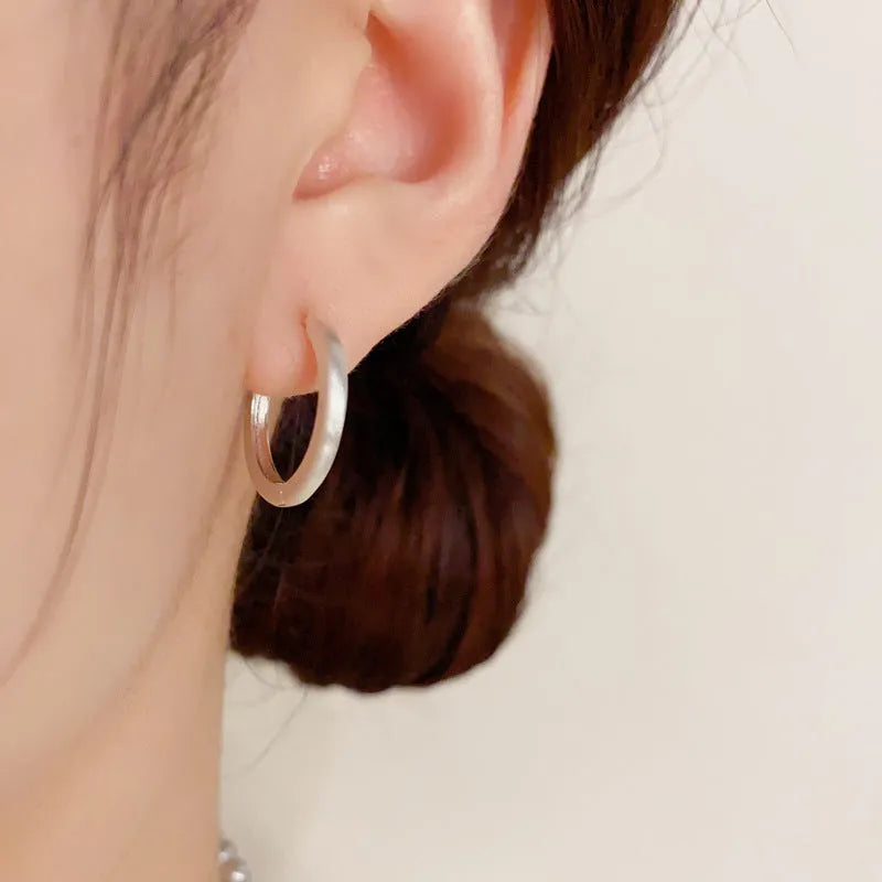 Circular geometric copper ear clips for women with gold or silver finish