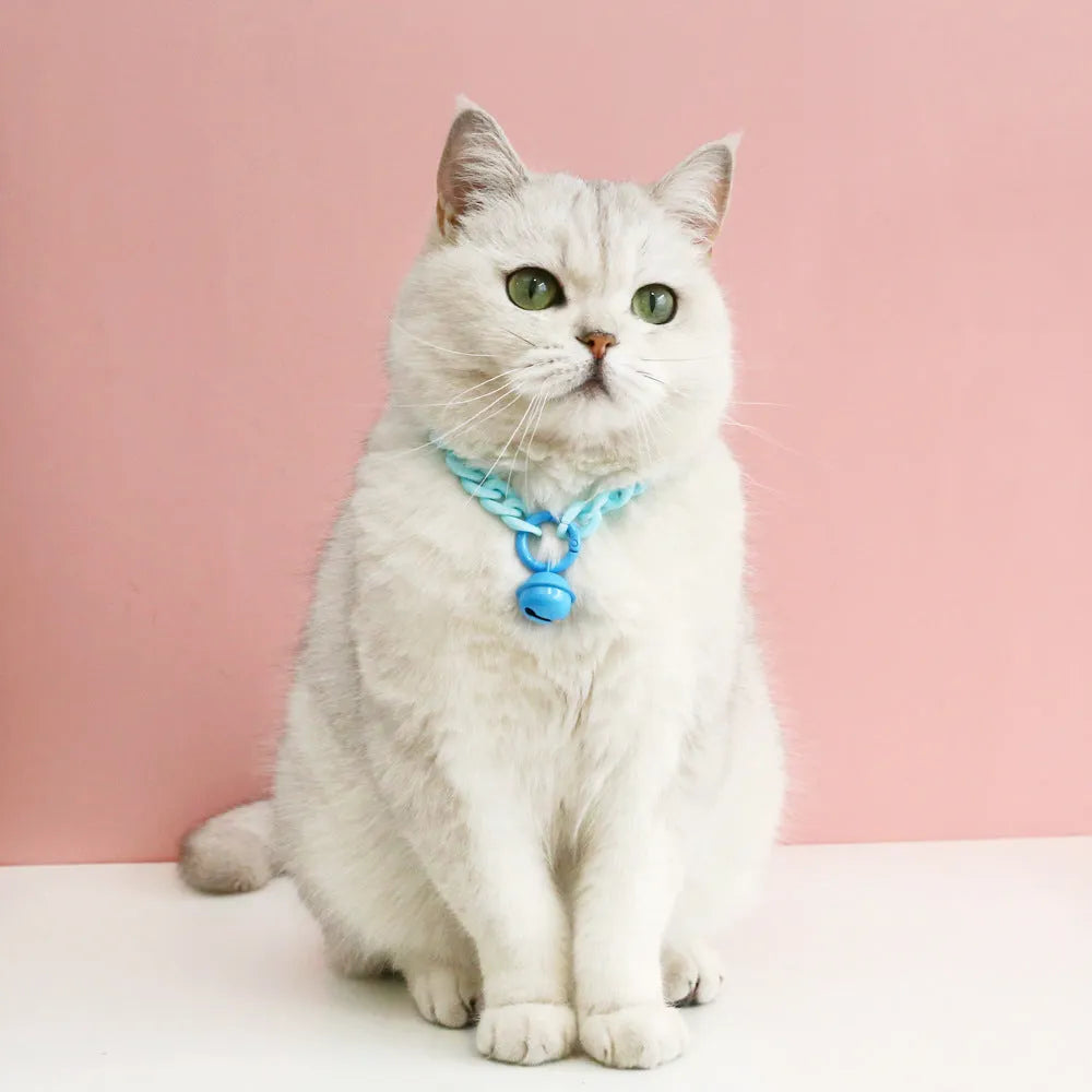 Plastic monochrome chain pet collar shown in chain blue, pink, and mixed colours for S and M sizes.