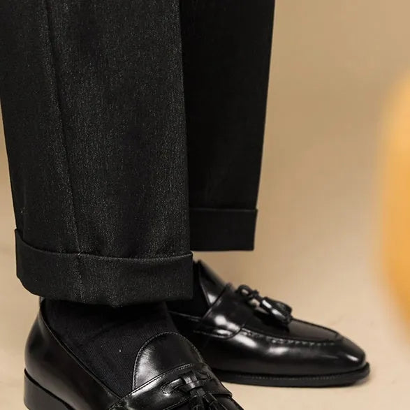 Men's black genuine leather tassel loafers with a rubber sole