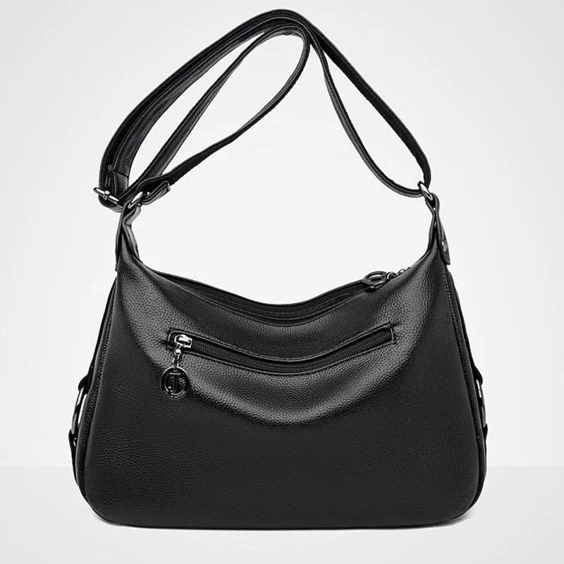 Women's blue soft PU crossbody bag showing interior phone and document compartments with zipper closure