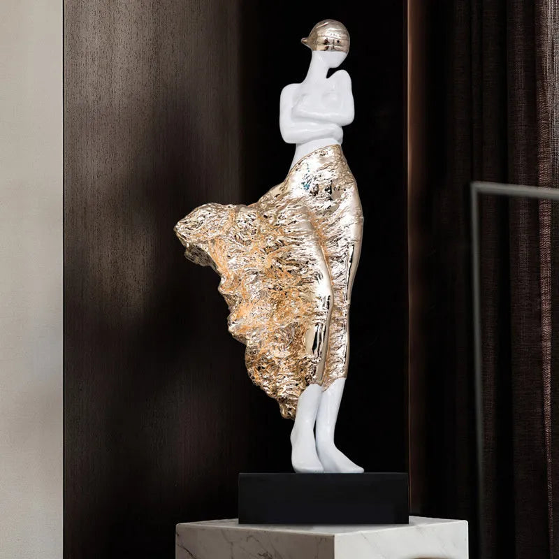 Tall metallic character sculpture ornament on a neutral background