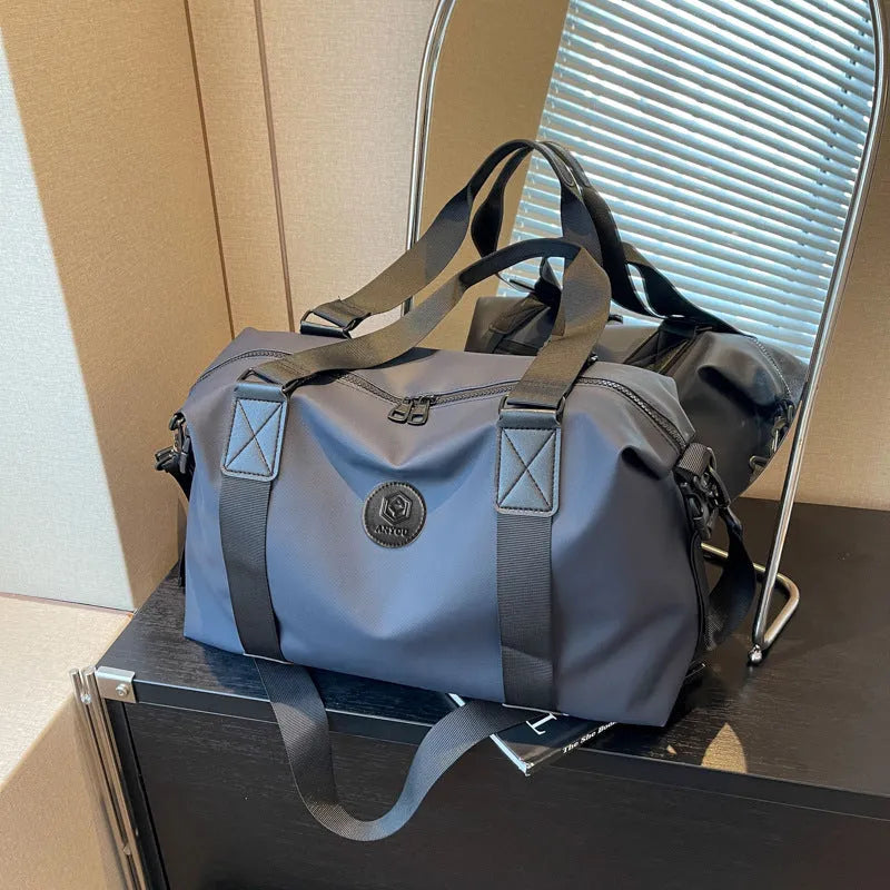 Waterproof Oxford cloth travel bag with 36-55 litre capacity in solid colour design