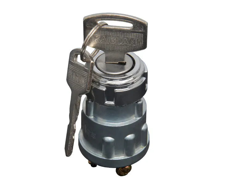 Copper ignition switch and key for trucks and forklifts on a white background.