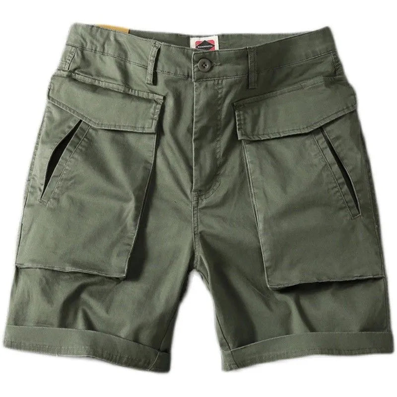 Men's army green cotton cargo shorts with multiple pockets, shown in a straight-leg summer street style.