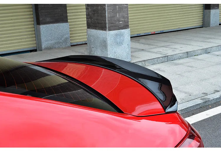 Mazda 3 Axela Exela tail trim spoiler in bright black finish for 2014-2021 model years