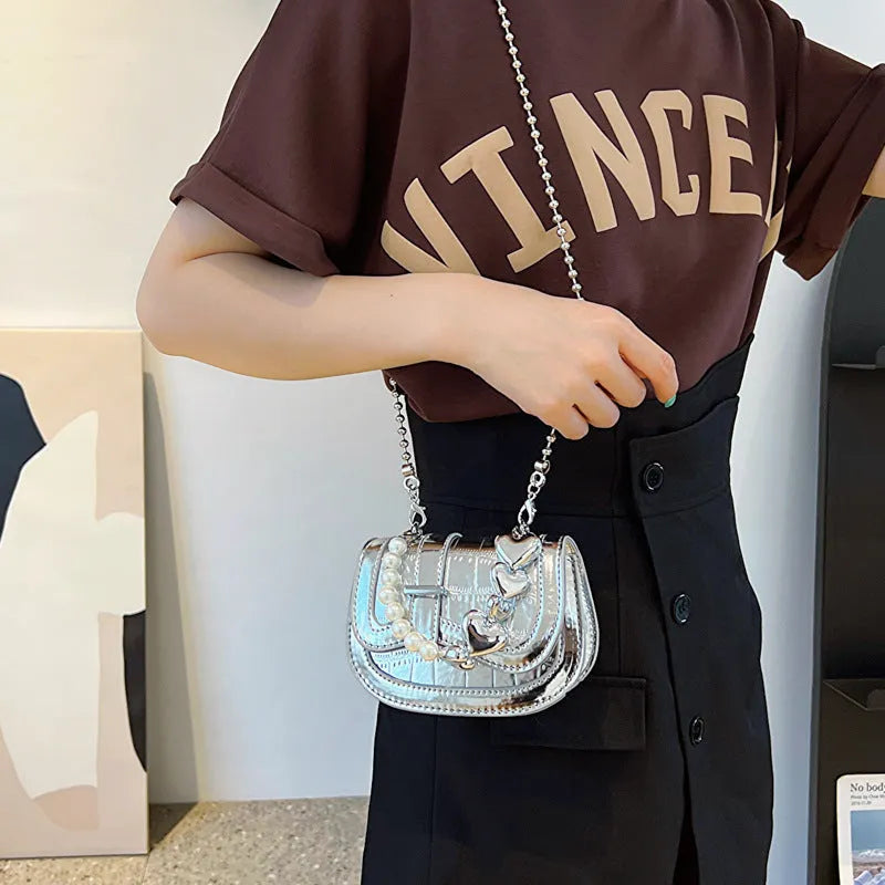 Horizontal square mini saddle bag in PU leather with sandwich pocket detail and adjustable shoulder strap