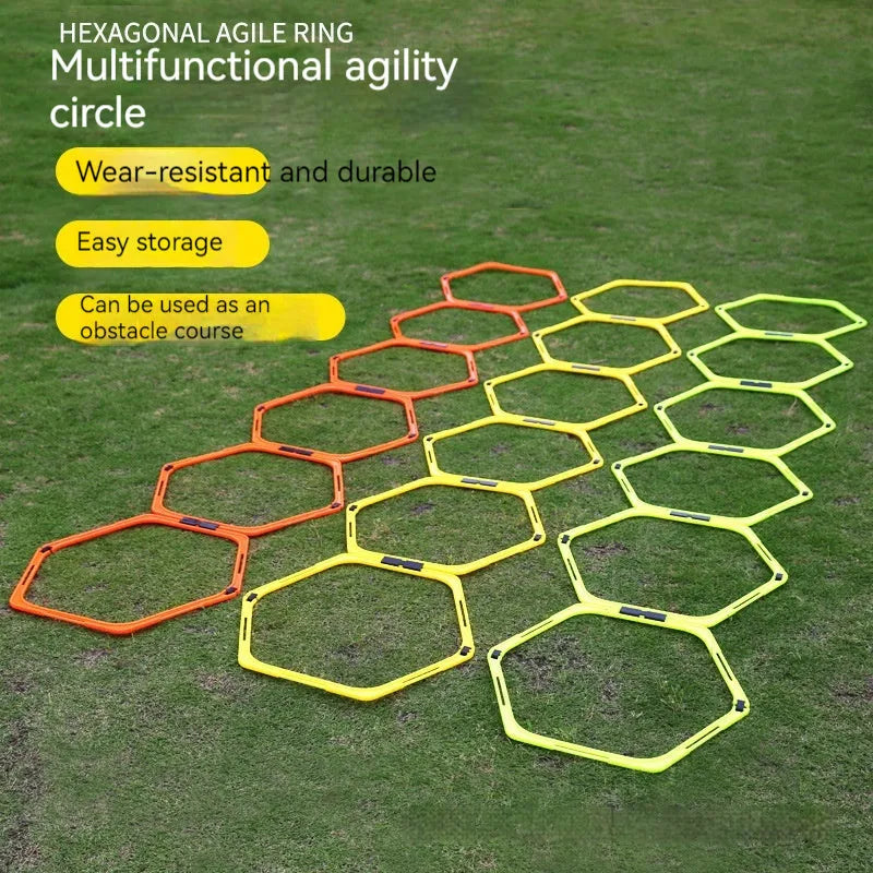 Six foldable yellow, green, and orange hexagon football agility training rings laid out on grass.