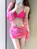 Women's blue four-piece bikini swimsuit set with shirt, bra, underwear, and skirt on hanger