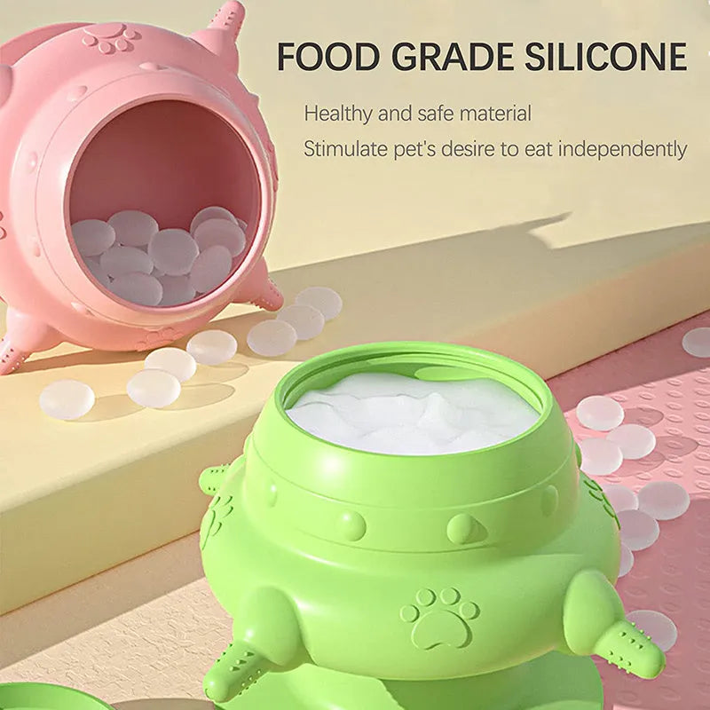 Pink silicone pet nursing device with milk bowl and four pacifiers for puppies and kittens.