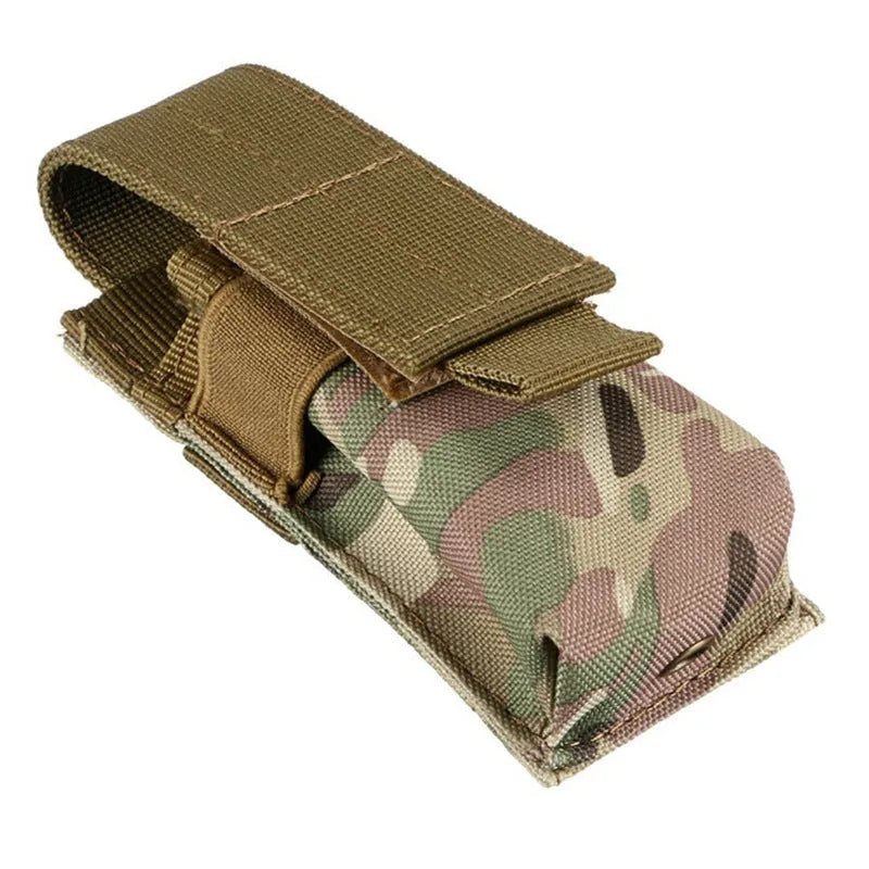 Black tactical molle waist bag for pistol cartridges or a small flashlight, showing elastic cord buckle.