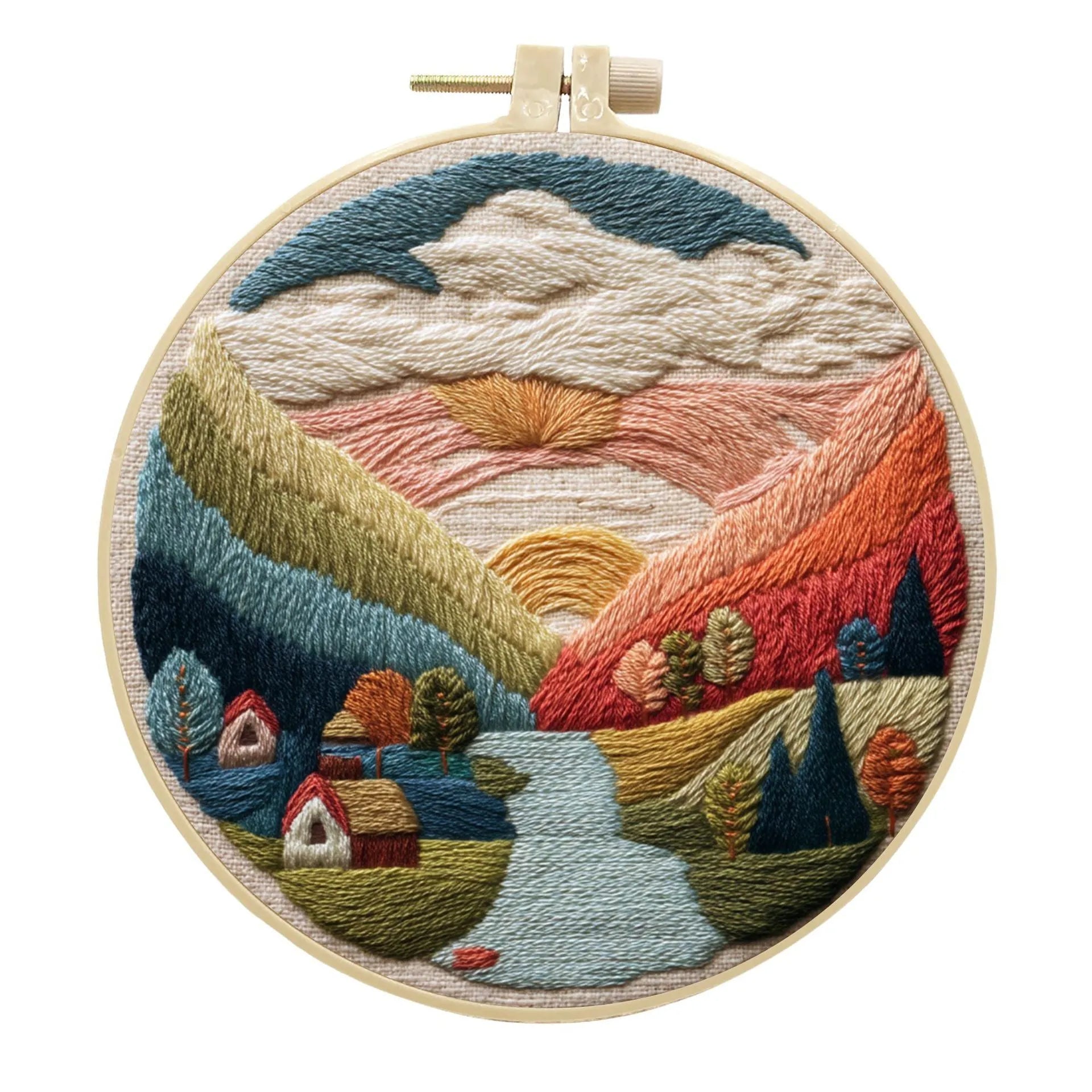 DIY landscape embroidery kit with cotton fabric, bamboo frame, threads and needles arranged for crafting