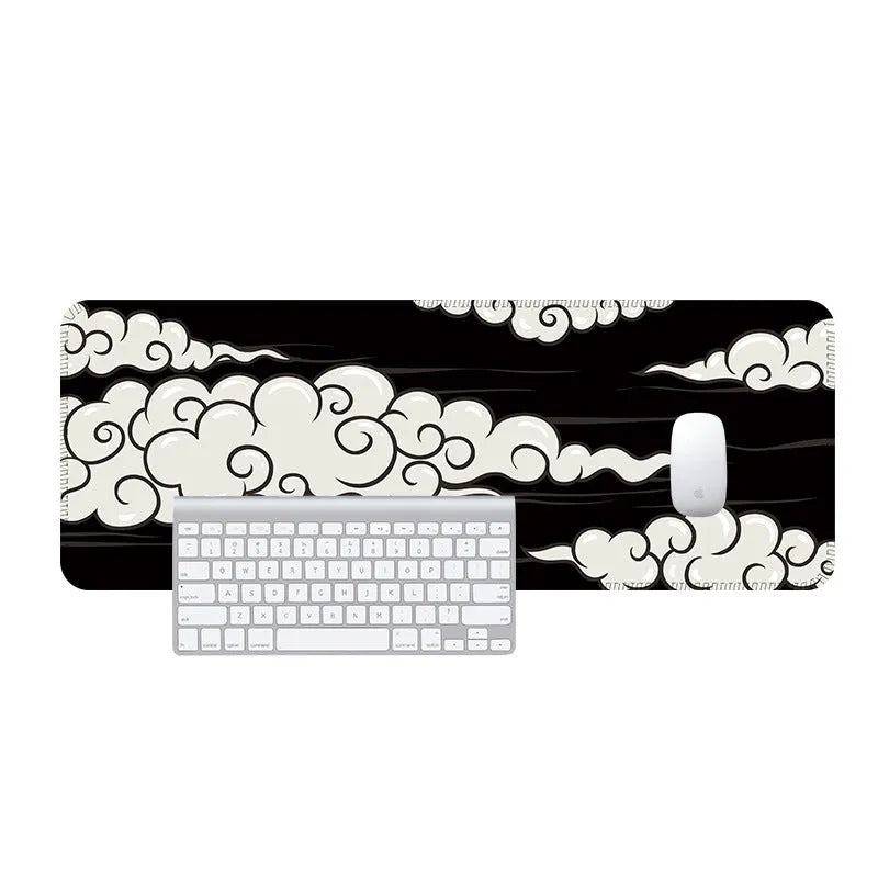 Large cloud pattern desk mat with non-slip rubber base on a wooden table.