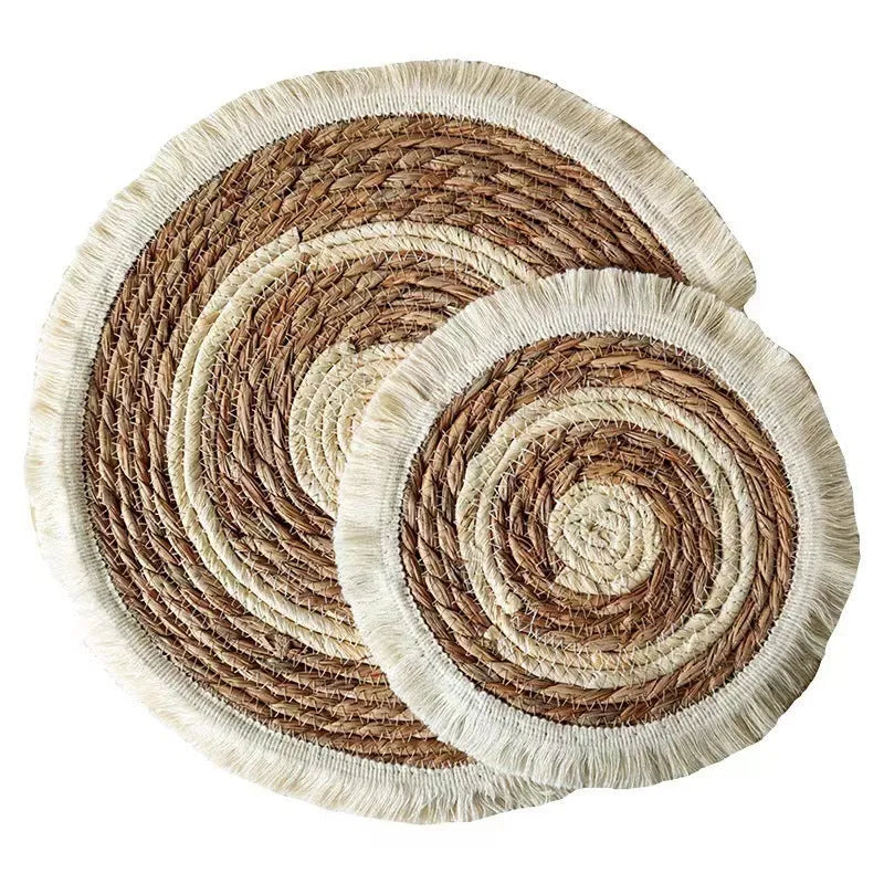 Round papyrus straw placemat with corn rope tassel detailing in modern simplicity style
