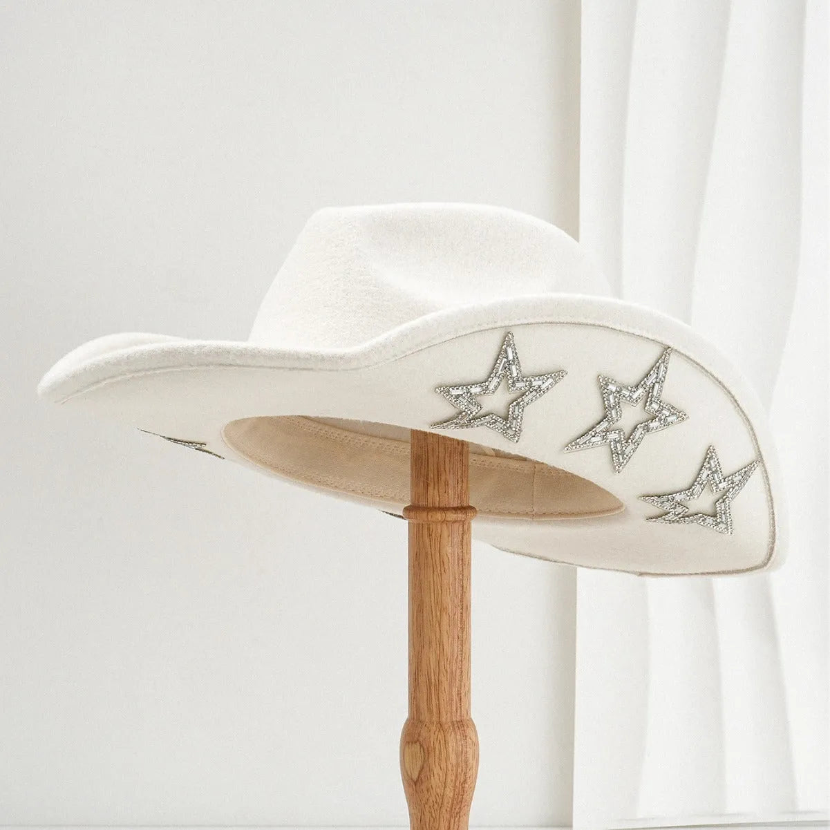 Brown polyester western-style top hat with a conical crown and a silver hexagonal star decoration on the front.