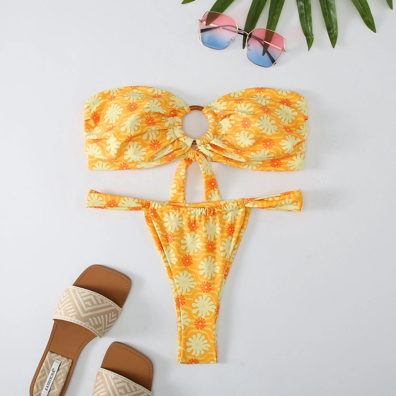 Women's floral printed tube top bikini swimsuit with brief backless design on mannequin
