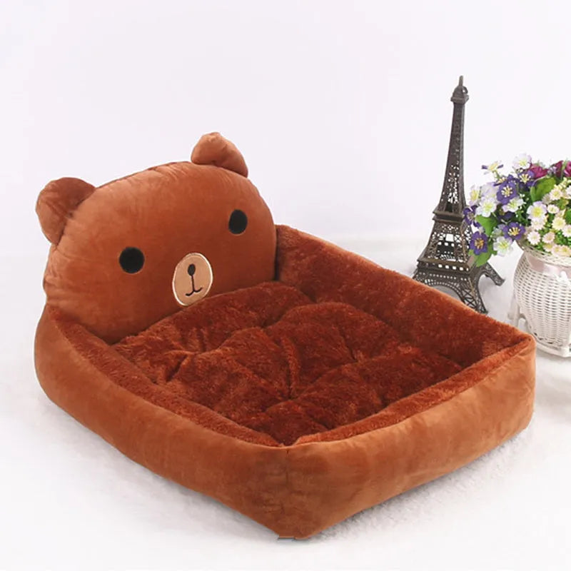 A cartoon-style washable pet sofa bed for small dogs and cats, shown in blue, brown, gray, or pink.