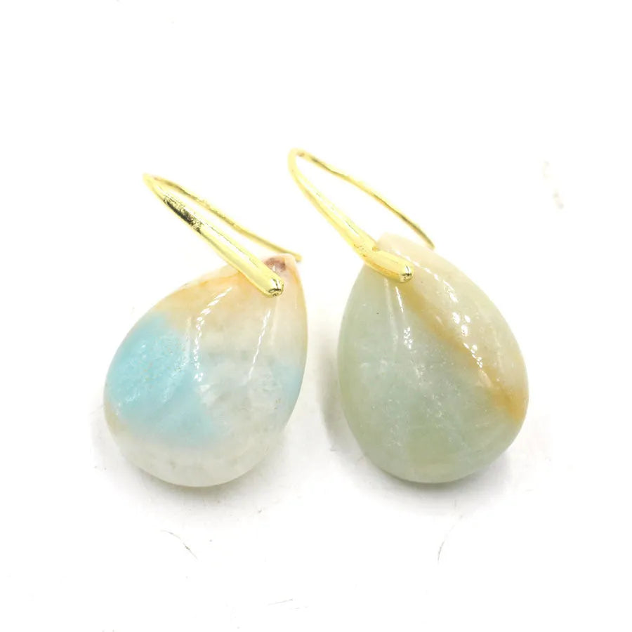 A pair of geometric water drop earrings made from crystal in one of nine colours, with an electroplated metal setting.