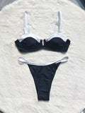 Black women's low waist bikini swimsuit with split stitching detail on the briefs.