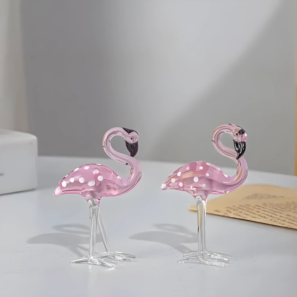 Pink crystal flamingo decorative ornament on table, available in separate or parallel styles.
