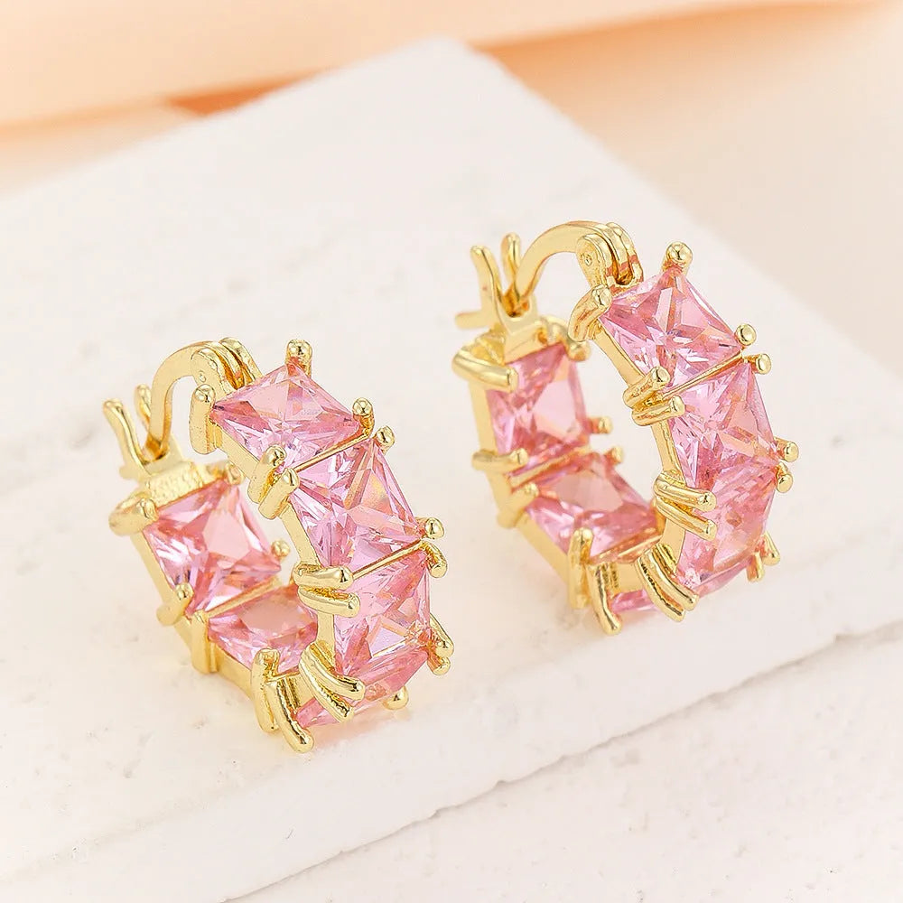 Geometric U-shaped earrings with round zircon crystals in black, pink or white with gold electroplating