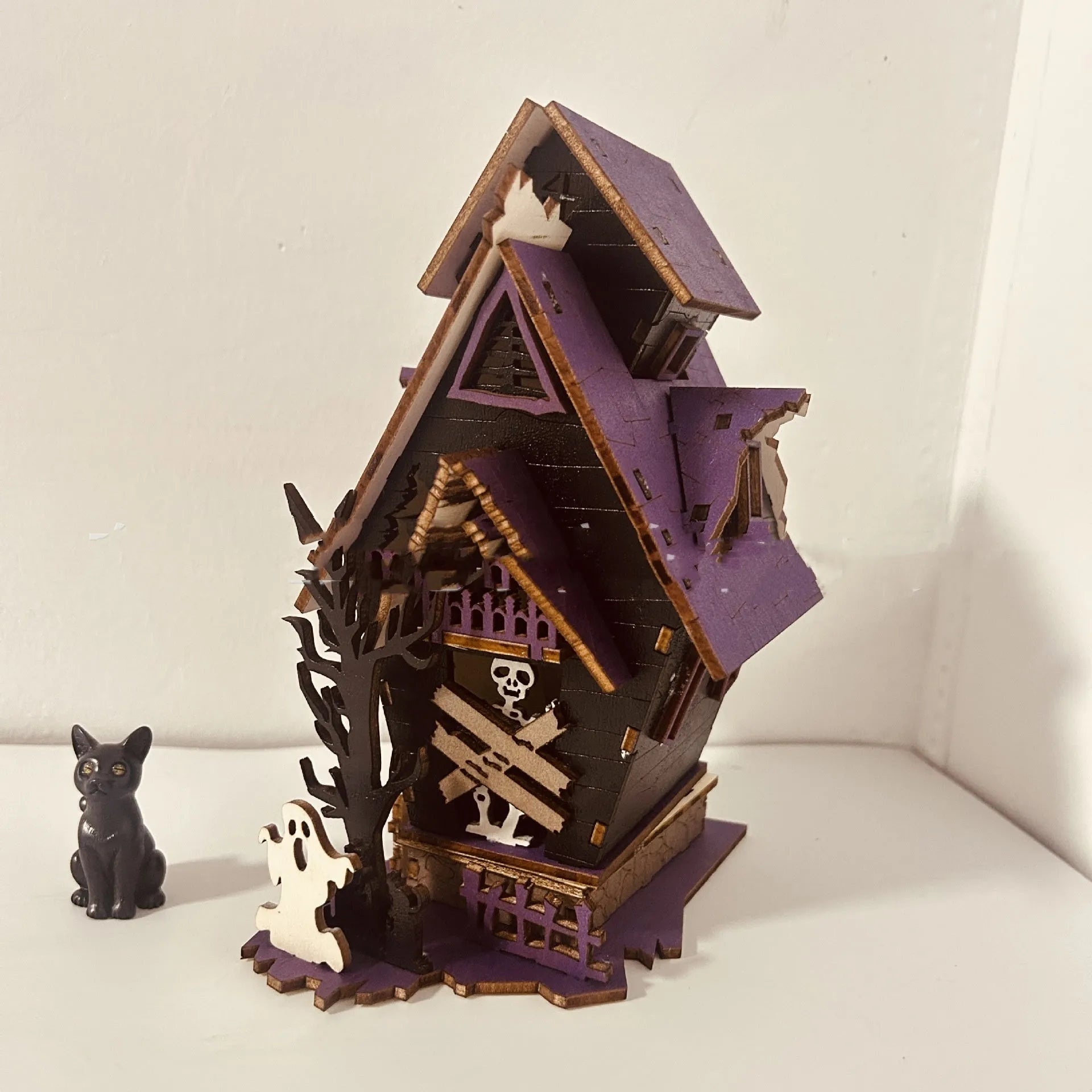 Wooden Halloween haunted house decoration with luminous paint finish, measuring 14x10.5x19cm