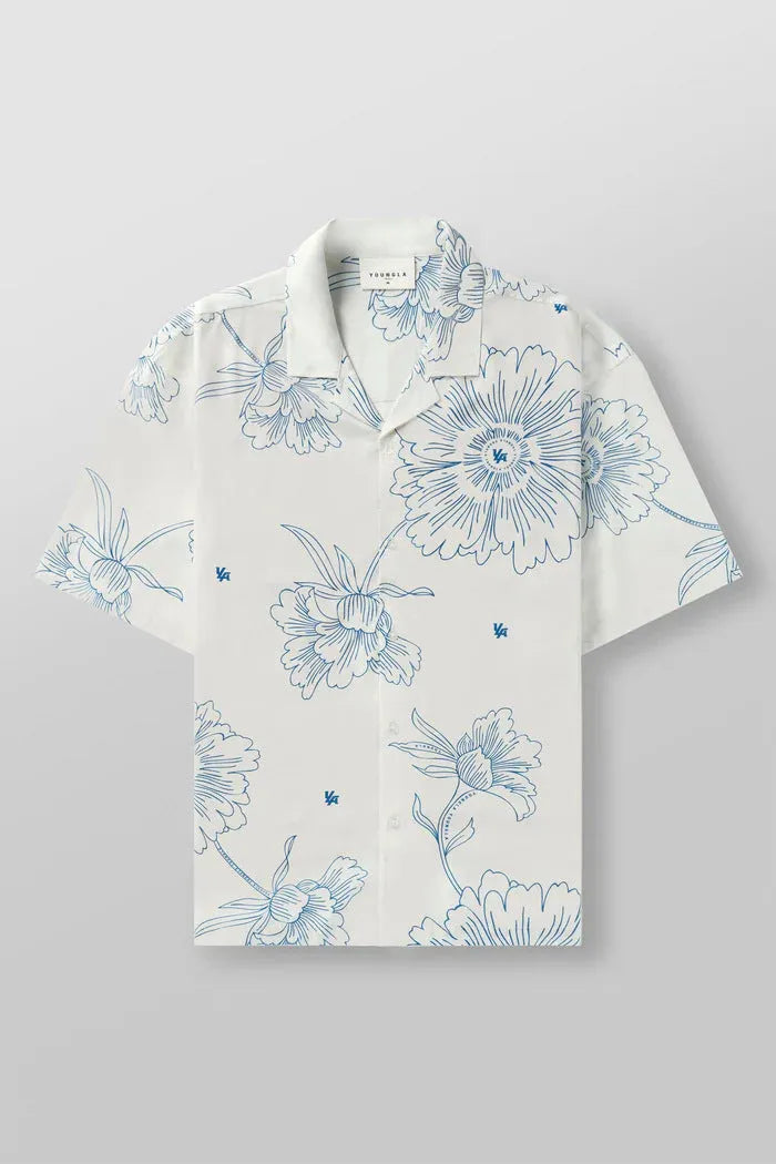 Man wearing a loose grey short sleeve cardigan top with a white floral print pattern.