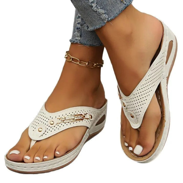 Women's retro-style flip-flop sandals with a herringbone pattern on the strap, shown in a light brown colour.