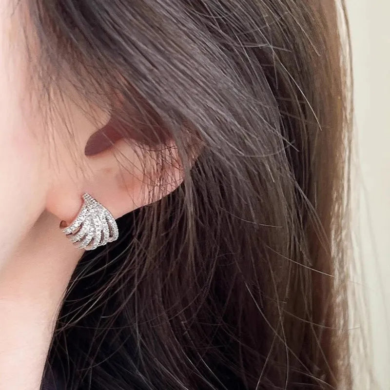 Women's geometric line design earrings with platinum electroplated finish on zircon material