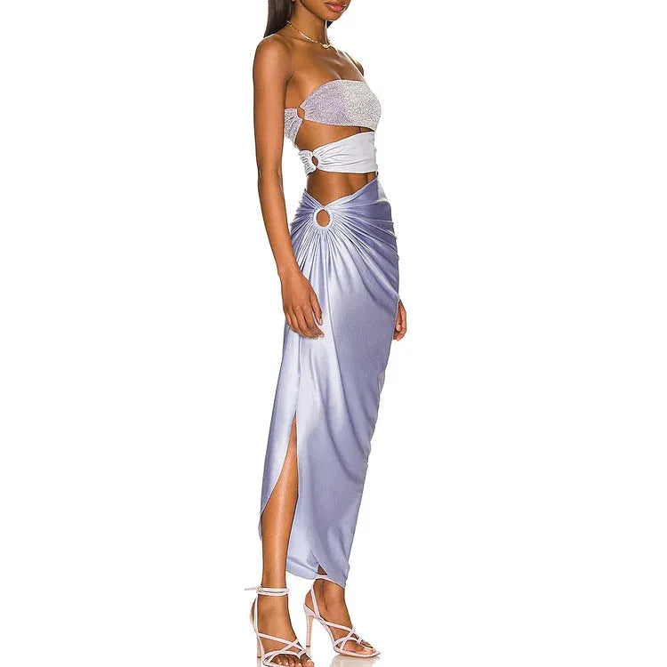 Purple one-piece swimsuit with coordinating wrap skirt set on beach background